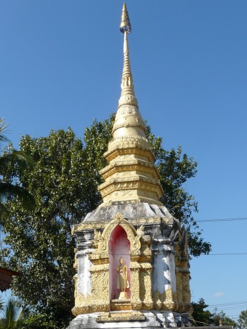 old stupa with gold paint